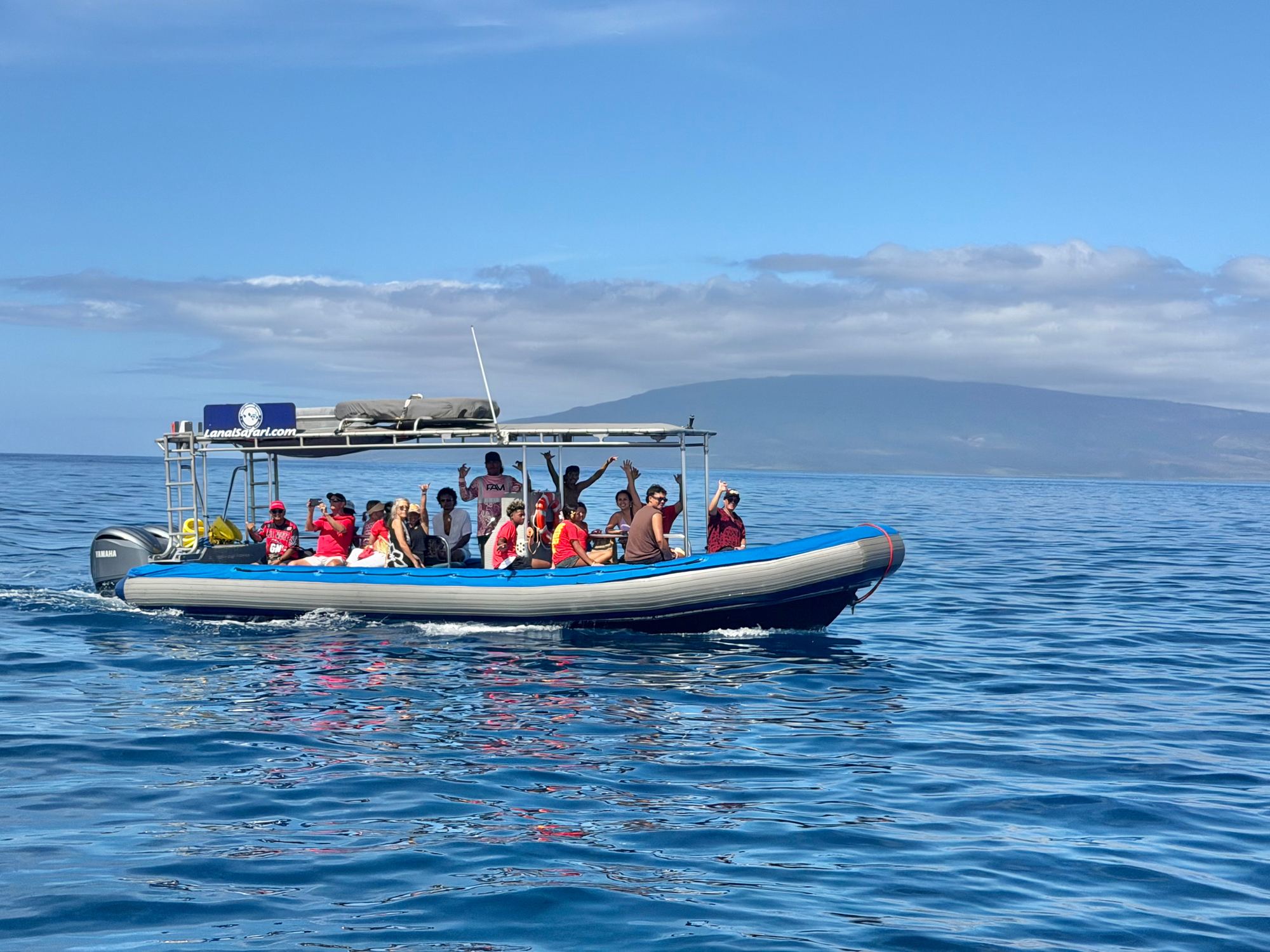 The Maui Whale Adventures rigid hull inflatable boat under way off West Maui